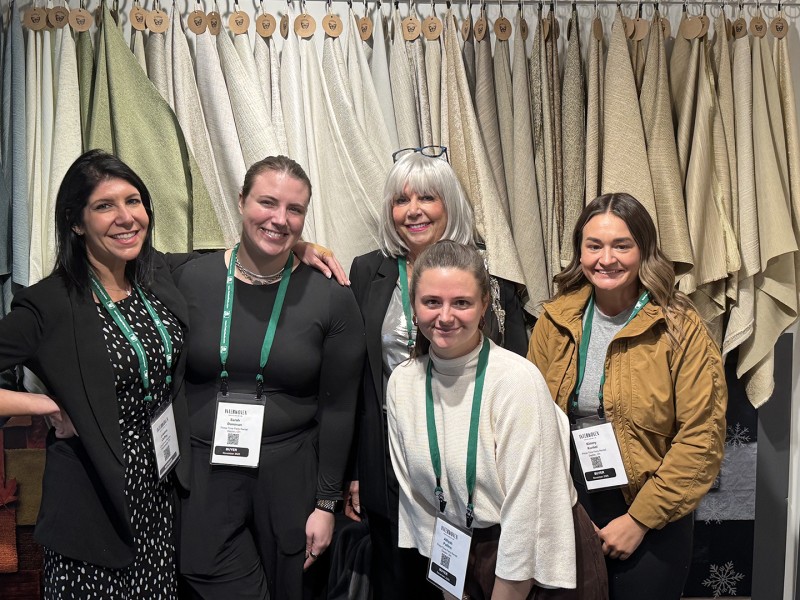 At Crestmont Fabrics: Cristina Harris Coffey, EVP Design, Crestmont (Hauppauge, NY converter) with customers Sarah Donovan, Alliyah Pullins and Kimmy Kunkel, all from Primetime Party Rental, Dayton, O. Behind Alliyah is Judi Harris, Crestmont CEO