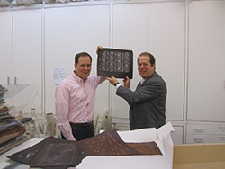 Brothers Cary and Scott Kravet show off design cut into Mulberry bark and held together with human hair