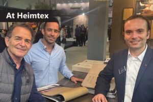 Keith and Garrett Gordon, principals of Architex, contract specialist from Chicago, USA shop wall covering with Gheorghe Sili, sales manager at KT Exclusive, Duesseldorf, Germany